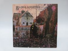 Black Sabbath (V06) large swirl/No Phillips credit/black cross.