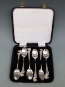 A cased set of six hallmarked silver teaspoons with bore head finials and engraved Edgbaston GC,