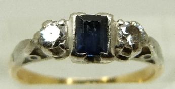 An 18ct gold ring set with a square cut sapphire and two diamonds in a platinum setting, size J, 2.