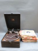 His Master's Voice 1930s wind-up portable gramophone, together with a quantity of 78rpm records,