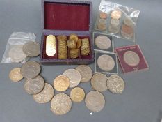 A collection of faux guinea gaming tokens,