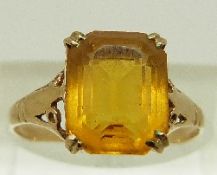 A 9ct gold ring set with an emerald cut citrine, size N, 1.