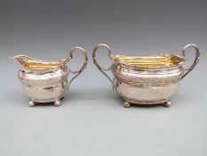 Georgian hallmarked silver sugar bowl and cream jug, both with shaped edge, scroll handle,