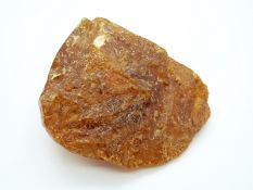 A large piece of raw uncut copal amber, 86 x 46 x 69mm, 131g.