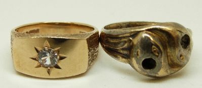 A 9ct gold ring in the form of two snakes and a 9ct gold ring set with cubic zirconia in a star