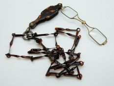 A pair of French silver and tortoiseshell lorgnettes