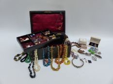 A collection of costume jewellery including beads, glass necklace, mother of pearl necklace,