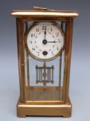 Brass c1910 corniche-style cased mantel clock,