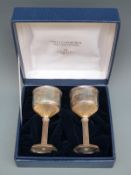 A cased limited edition pair of Wells Cathedral commemorative hallmarked silver goblets,