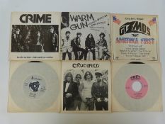 Six USA punk singles including The Curse, Gizmos, Crucified, Warm Gun,