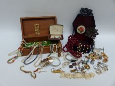 A collection of costume jewellery including jet brooch, silver fob, white metal pot, silver bangle,