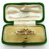 Art Nouveau 15ct gold brooch set with a pearl , round cut and pear cut peridots,