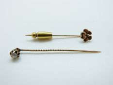 A late Victorian stick pin set with a round cut diamond of approximately 0.