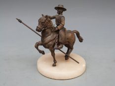 A bronze figure of a Spanish horseman / caballero on alabaster base, 11.