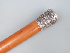 Chinese white metal topped malacca walking cane, the top embossed with people playing games,