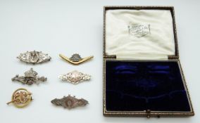 A collection of brooches including Victorian hallmarked silver sweetheart brooch, London 1887,