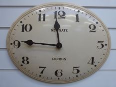 Newgate oval quartz wall clock in coffee and cream colour with Arabic numerals,