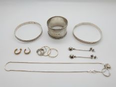 Two silver bangles, silver napkin ring, silver earrings and necklace,