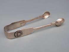 A pair of Victorian provincial hallmarked silver fiddle pattern and shell pattern sugar tongs,