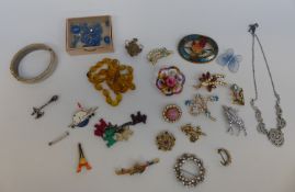 A collection of costume jewellery including white metal Victorian brooch in the form of an axe,