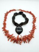 A tortoishell bracelet and a coral necklace