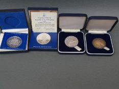 Two Cook Islands cased 1973 two dollar coins together with a Philippines Republic 1975 50 Piso and