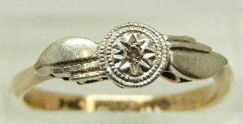 A 9ct gold ring set with a diamond in a palladium setting, size K, 1.