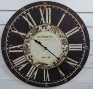 A caseless quartz wall clock with black Roman chapter ring,