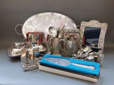 A quantity of silver plated ware including toast rack, tray, hallmarked silver handled cake slice,