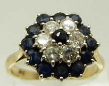 A 9ct gold ring set with a sapphire surrounded by six diamonds each approximately 0.