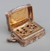 Victorian hallmarked silver vinagrette of shaped form with engine turned decoration,