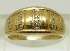 A 9ct gold ring set with rows of diamonds, size N/O, 4.