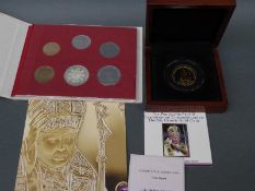 A cased double crown 9ct gold coin commemorating the canonisation of Pope John Paul II together