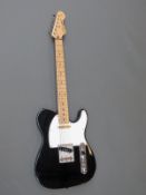 Vintage brand reissued Series V2 electric guitar in black gloss finish with white finger board,