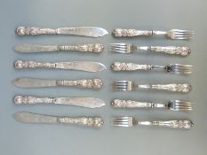 George V set of six hallmarked silver handled fish knives and forks with vine decoration to handles,