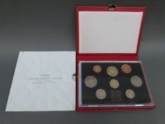 A 1986 deluxe cased Royal Mint coin collection and a 2007 souvenir commemorative Diamond Wedding