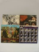 The Beatles and associated - A small collection of LPs and box sets including a tray,