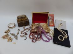 A collection of costume jewellery to include faux pearls, silver bangle, locket,