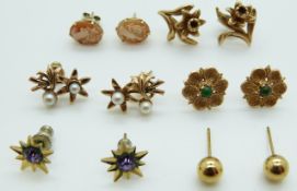 A group of 9ct gold earrings including turquoise set, pearl set, a pair in the form of daffodils (7.