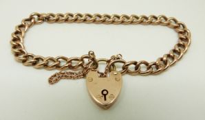 A 9ct rose gold curb link bracelet with heart padlock clasp, 7.