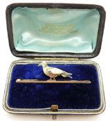 A 15ct gold brooch set with enamel and abalone/ mother of pearl in the form of a pigeon,