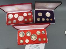 Three cased proof coin sets comprising First Coinage of the British Virgin Islands and two