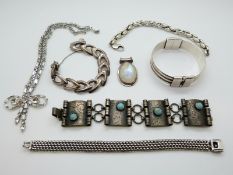 A silver bangle, white metal bracelet set with turquoise, three silver bracelets,