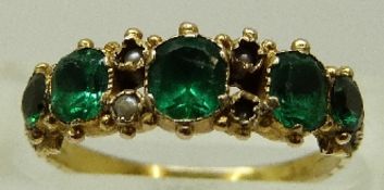 A 15ct gold ring set with green paste and seed pearls, size L, 1.
