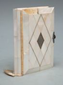 A mother-of-pearl board book 'The Little Key of Heaven' with pressed crucifix inside front cover