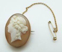 A 9ct gold pendant/brooch set with a cameo in the form of a young woman
