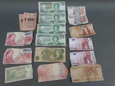 A quantity of used bank notes, both world and UK, includes two current 10 euro notes,