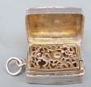 A possibly American white metal vinagrette with piereced gilt inner cover, stamped 925 Sterling,