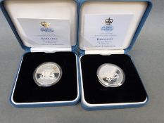 Two 1997 cased silver Barbados dollars with certificate