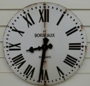 A caseless quartz dial wall clock with distressed look enamel Roman dial stamped 'Newgate Bordeaux',